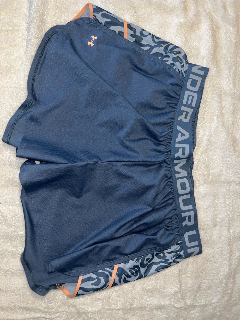 Under Armour Women’s plus blue Athletic Shorts with Coral Accents